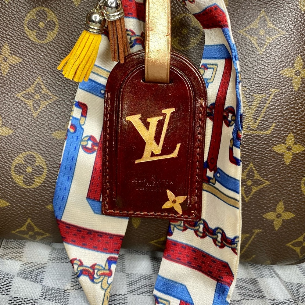 **Sold******Authentic Louis Vuitton keychain  tag